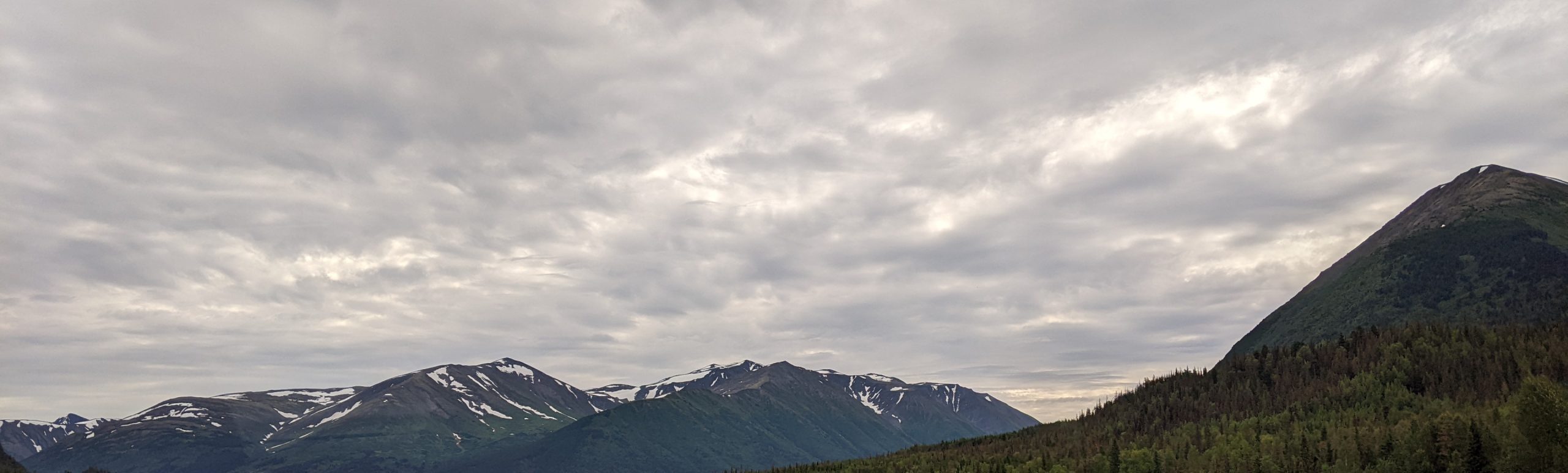 decorative backgound image of mountains and gray clouds